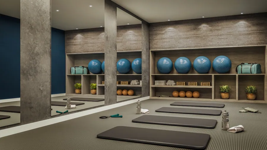 Sala de pilates com colchonetes e bolas