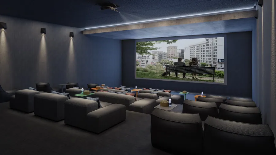 Sala de cinema com poltronas e tela ampla